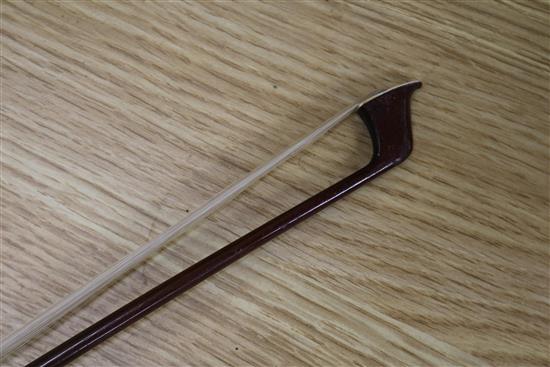 A silver mounted violin bow, an ivory mounted violin bow and a late 19th century German violin, cased